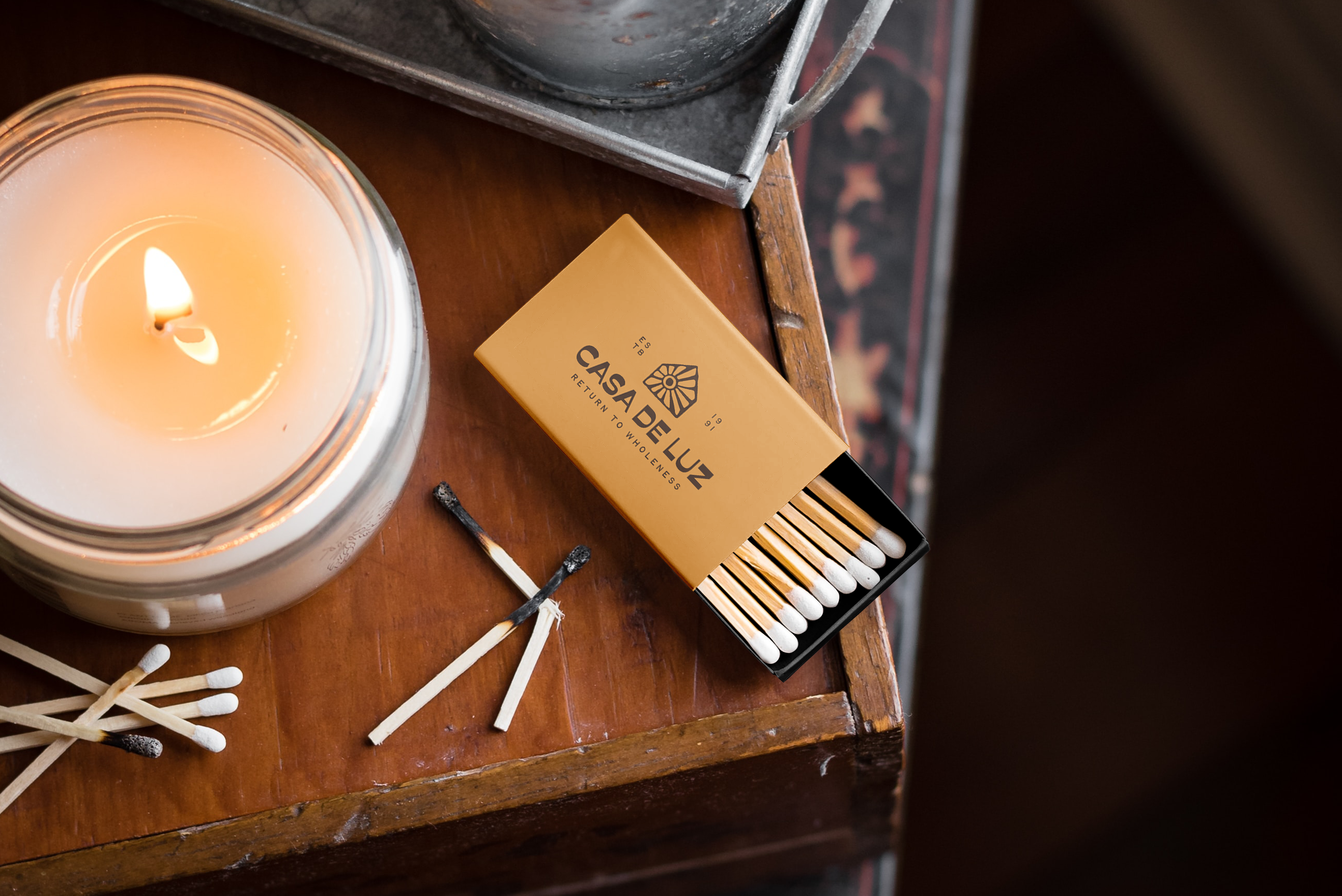 Stationery design of letterhead and business cards for the company Anders on top of a blurred photo of a house interior.